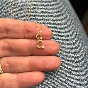 Alison Lou designer yellow gold necklace with “C” initial and small diamond.